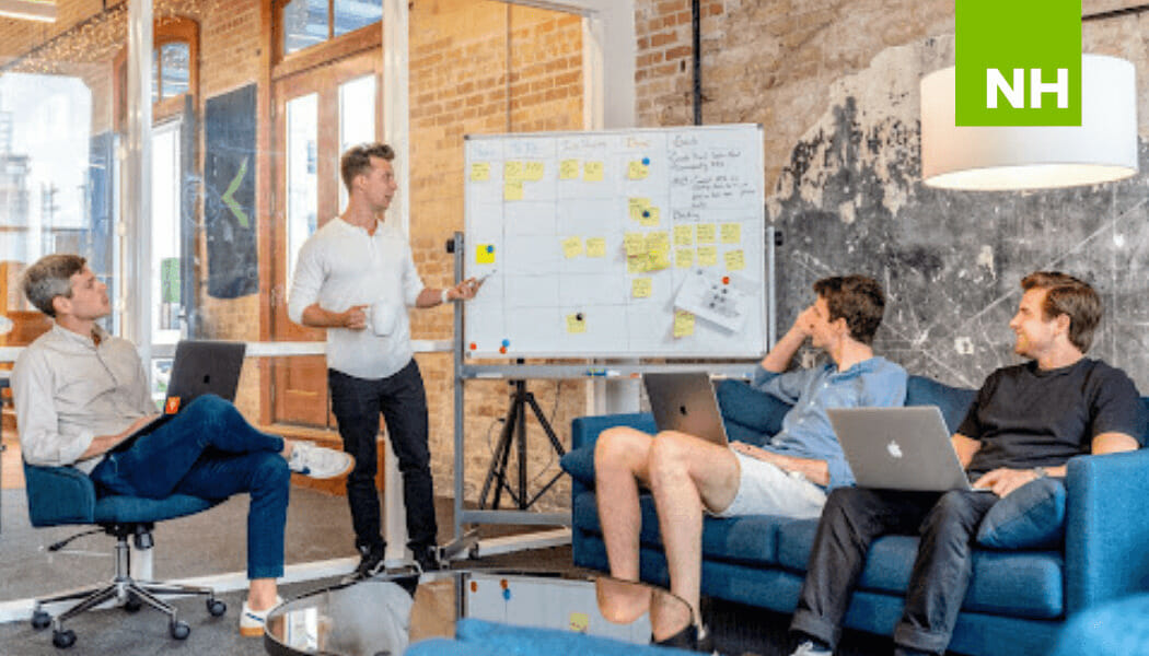 Four employees working in an urban office