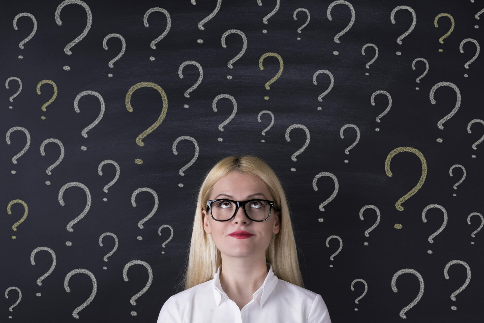 Woman in glasses pondering ethical dilemmas