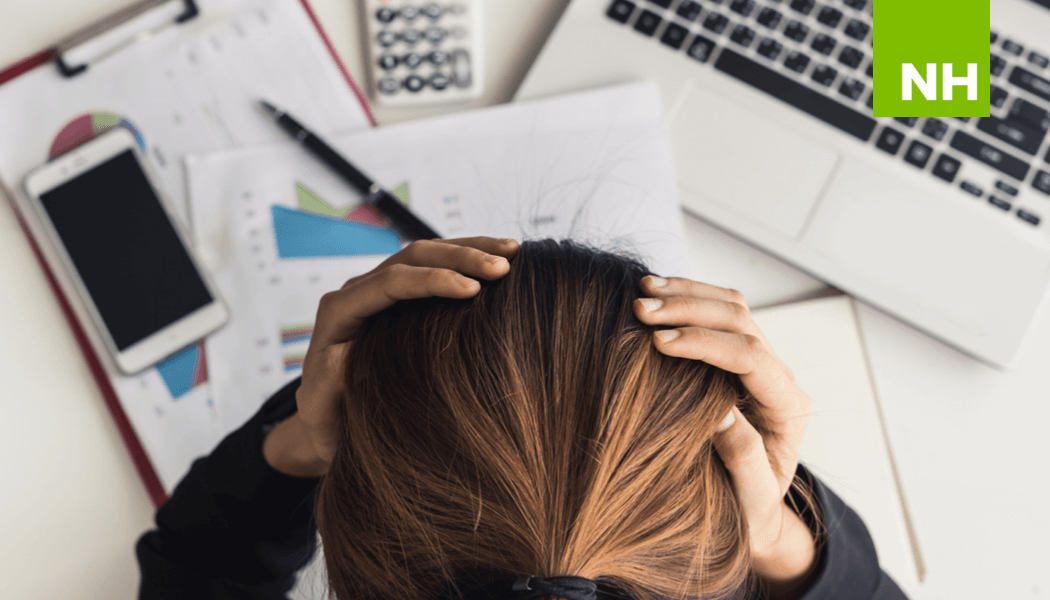 Overhead view of busy woman at her desk